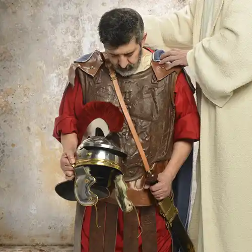 Jesus praying for kneeling Roman soldier having put on the whole armor of God