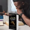 Man studying the Bible with The Armor of Light book